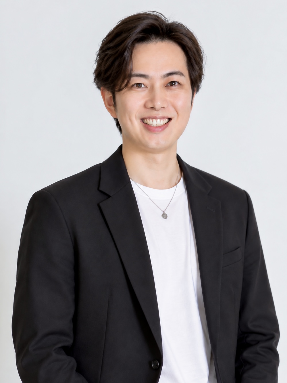 自然な笑顔のPassion代表 吉田秀幸